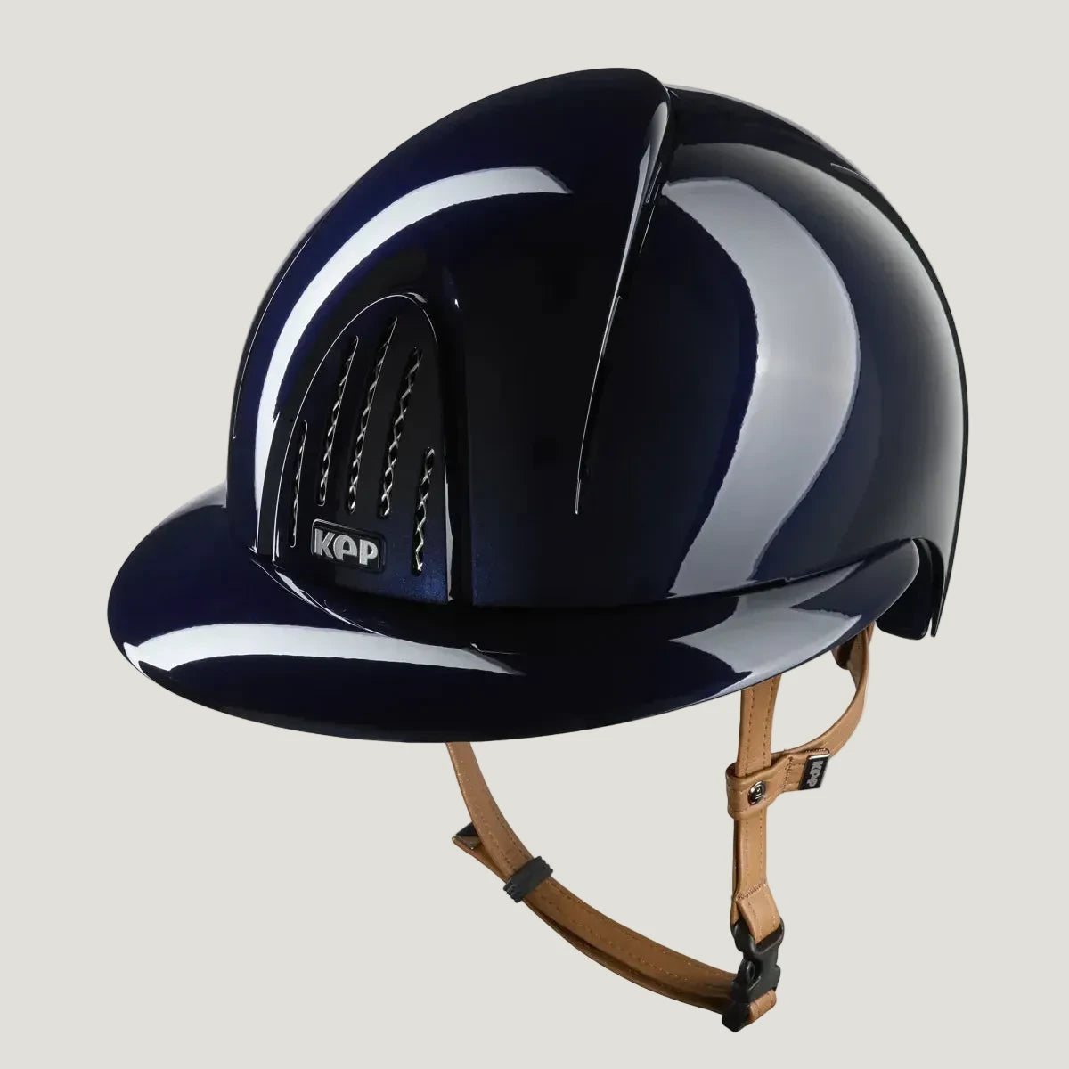 Navy riding helmet with white stripe and KAP logo on a white background