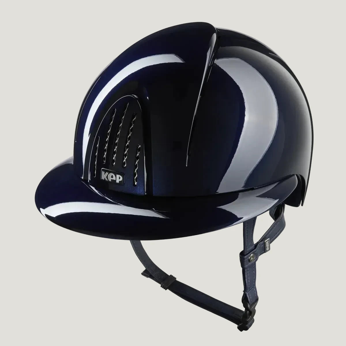 Navy riding helmet with white stripes on a white background