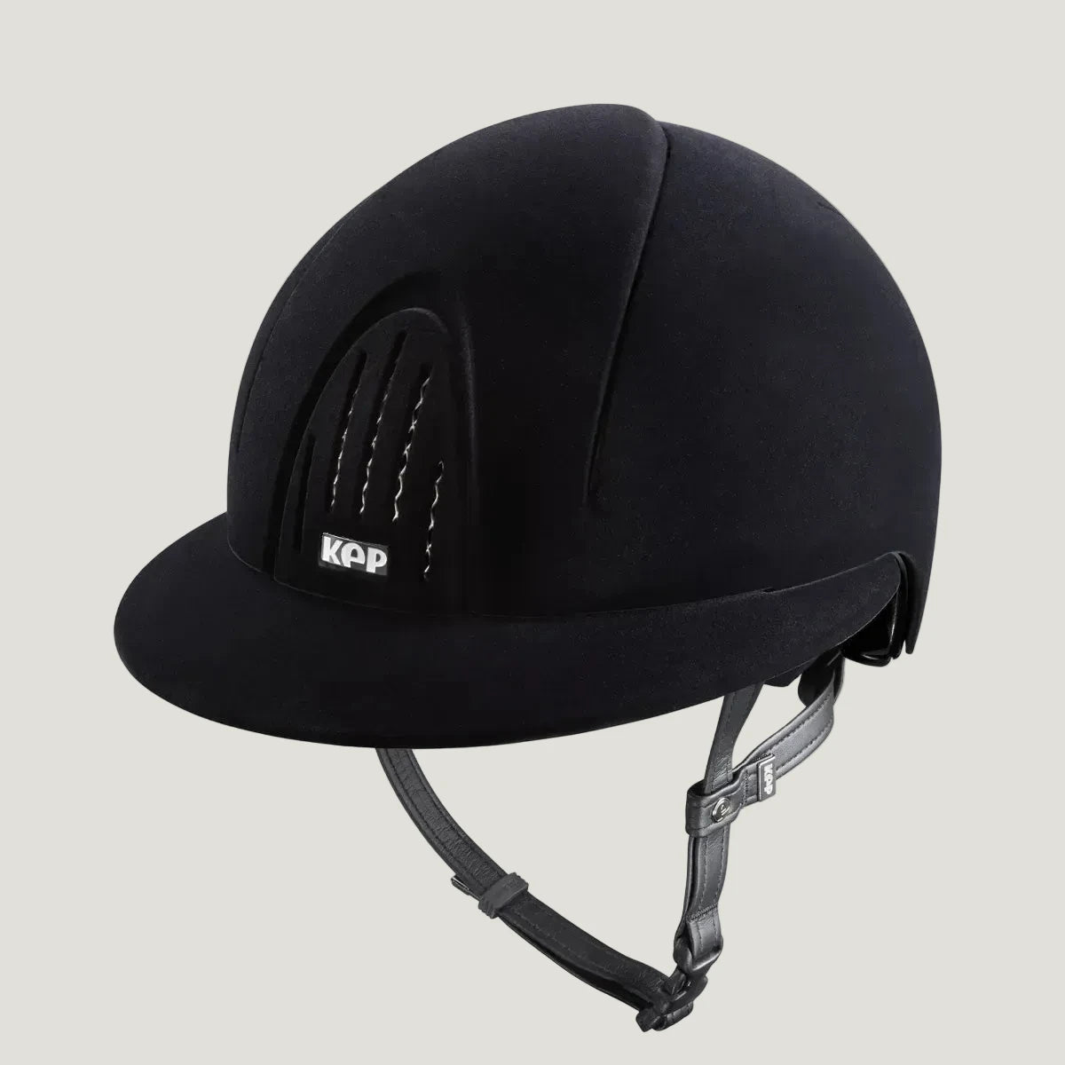 Black riding helmet with KAP logo on a white background